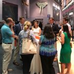 new faculty and professional staff gathering around table at networking event at florida museum